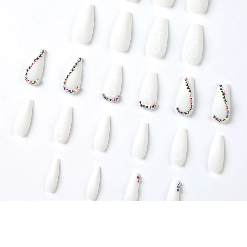 Artful Nail Extensions with Heart Design and Glitter Accents Stornfield
