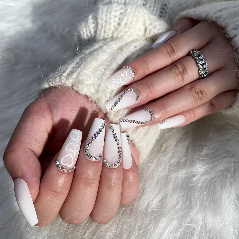 Artful Nail Extensions with Heart Design and Glitter Accents Stornfield