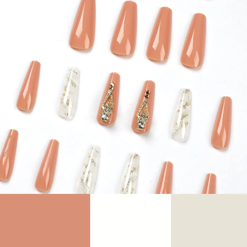Artful nail extensions with glitter embellishments and delicate accents Stornfield