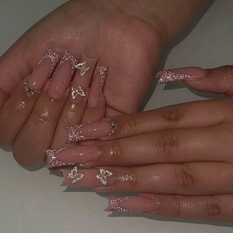 Artful Nail Extensions with Glitter and Decorative Accents Stornfield