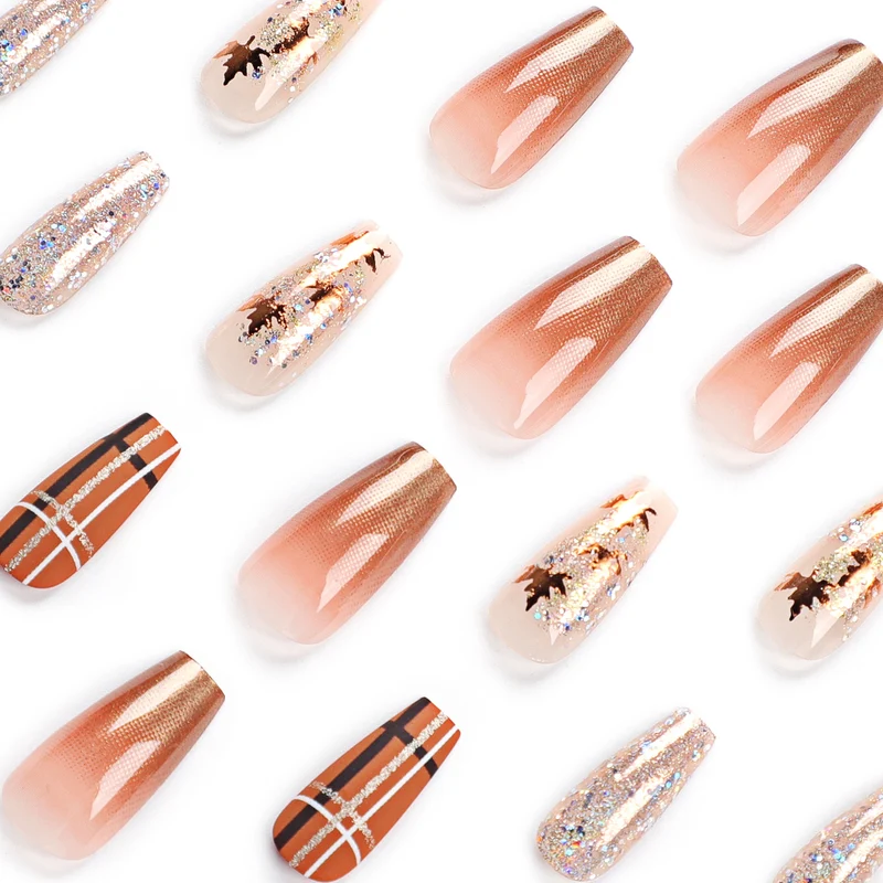 Artful nail extensions with glitter and leaf patterns Stornfield
