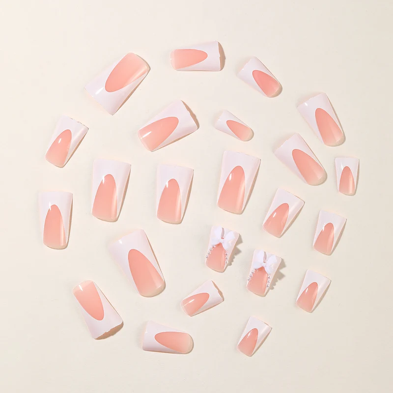 Elegante Stiletto-Nagelkunstverlängerungen mit Schleifenakzenten Karnz