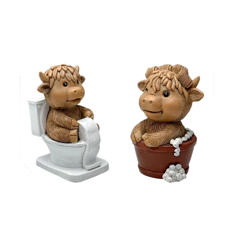 Funny decorative figure of a Highland cow on toilet Stornfield