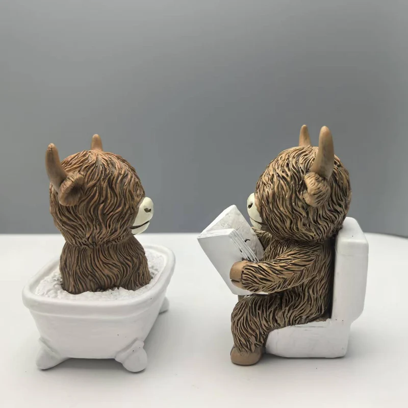 Funny decorative figure of a Highland cow in a bathtub Stornfield