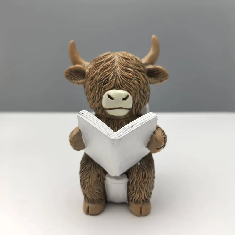 Funny decorative figure of a Highland cow in a bathtub Stornfield