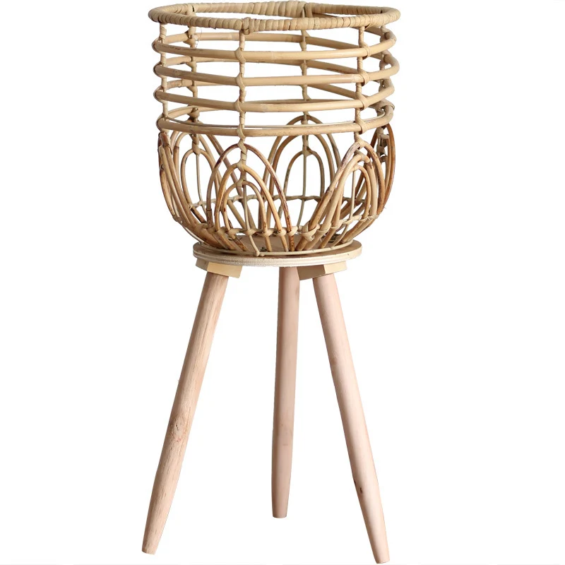 Stylish plant stand made of rattan and wood Stornfield