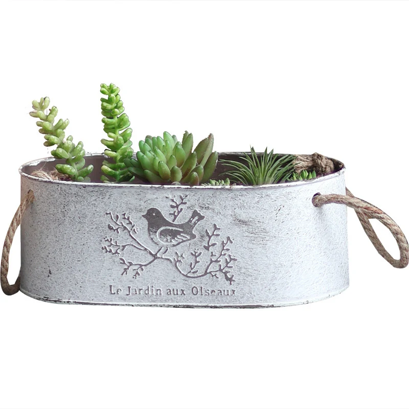 Decorative storage basket made of metal with natural design Stornfield