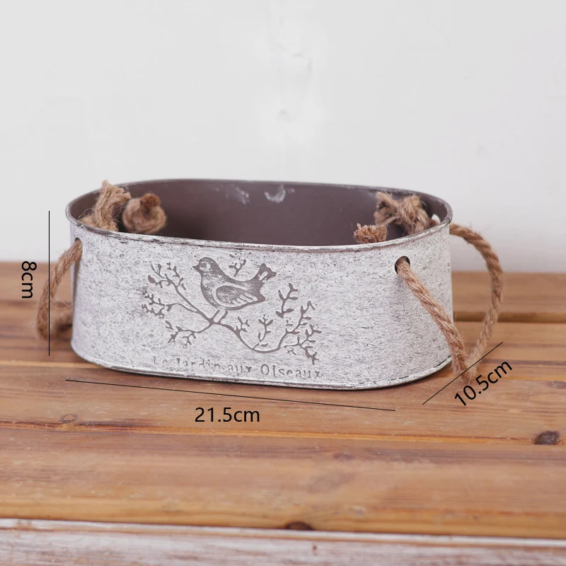 Decorative storage basket made of metal with natural design Stornfield