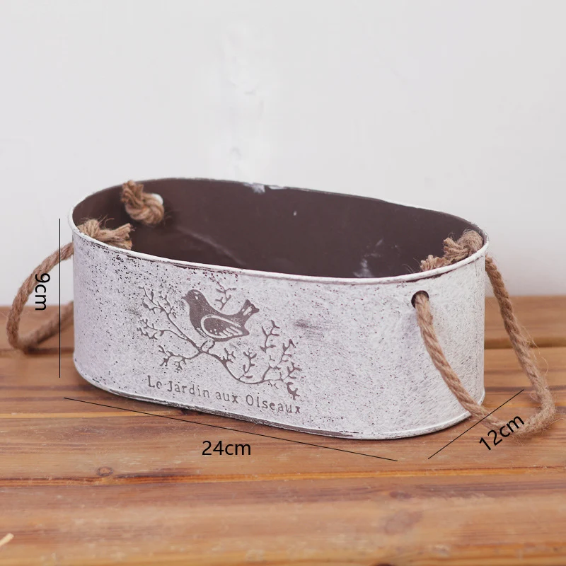 Decorative storage basket made of metal with natural design Stornfield