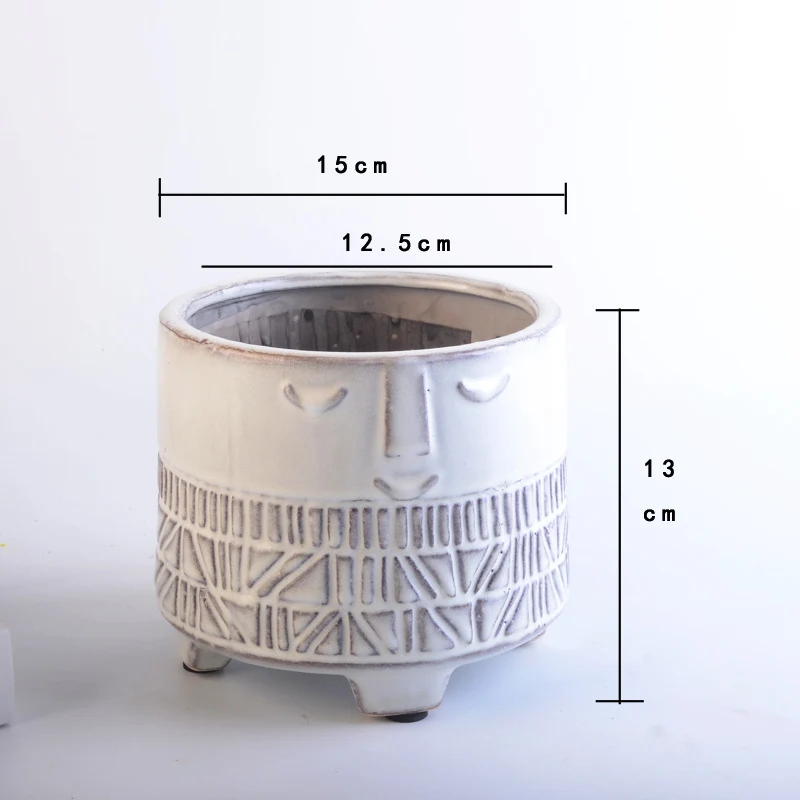 Decorative plant pot with facial features Stornfield