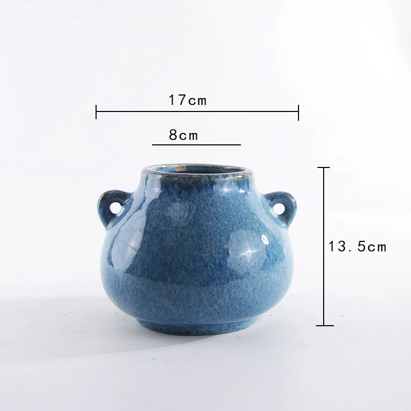Decorative ceramic pot with playful handles Stornfield
