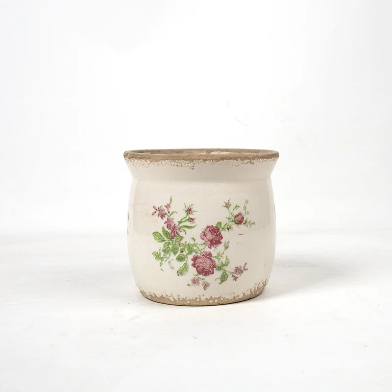 Decorative ceramic plant container with artistic design Stornfield