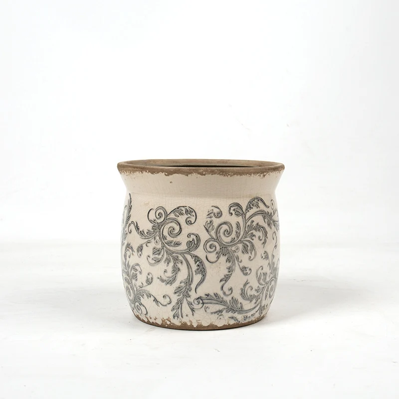 Decorative ceramic plant container with artistic design Stornfield
