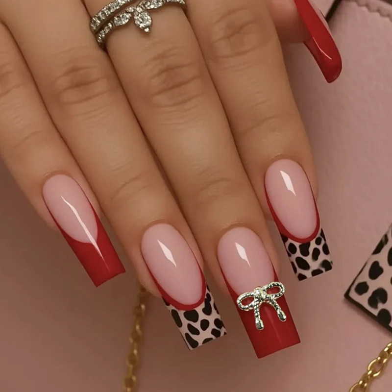 Stylish Acrylic Nail Extensions with Bow and Leopard Print Stornfield