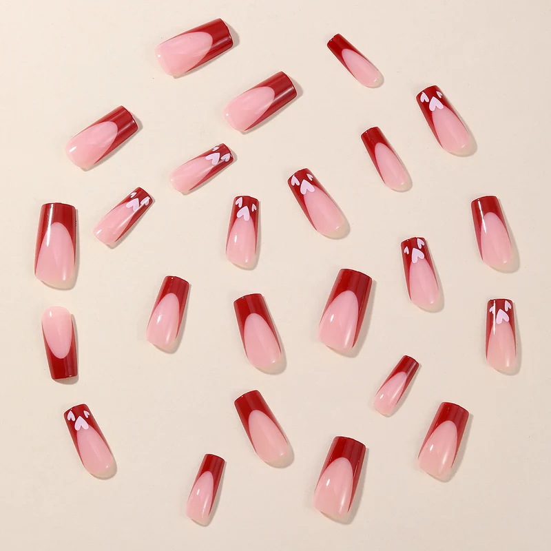Heart-Patterned Acrylic Nail Art Extensions Stornfield