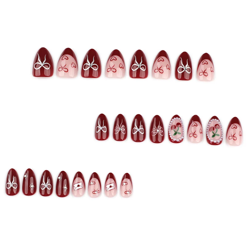 Kunstvolle Nageldesigns mit Schleifen- und Rosenmotiv Karnz