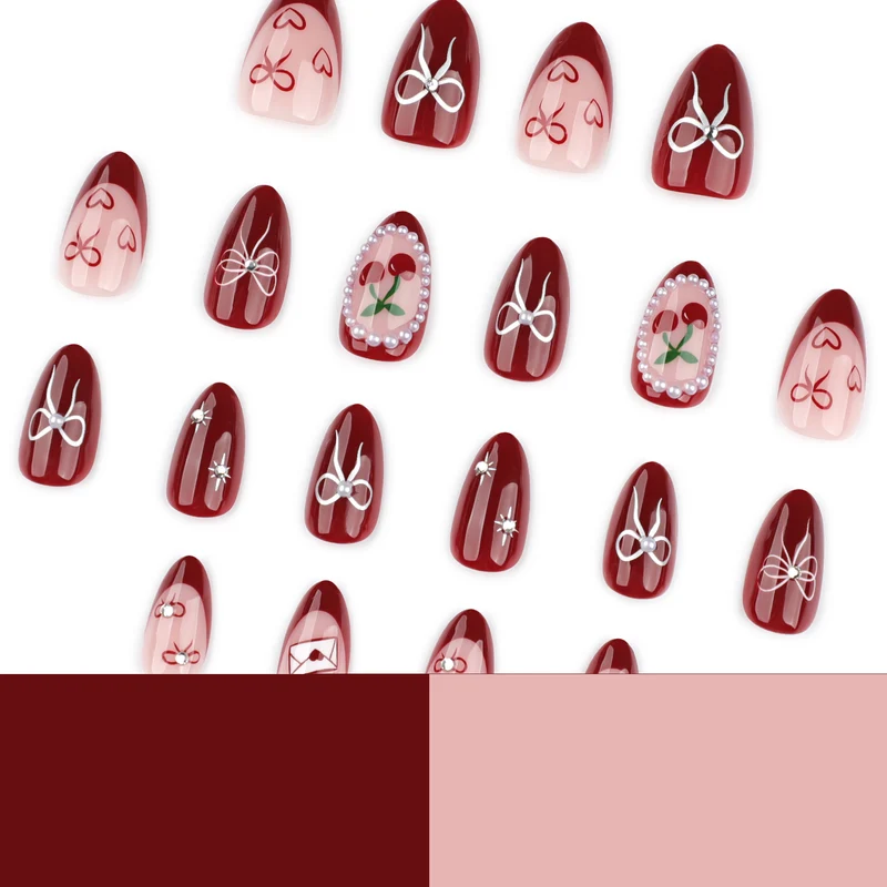 Kunstvolle Nageldesigns mit Schleifen- und Rosenmotiv Karnz