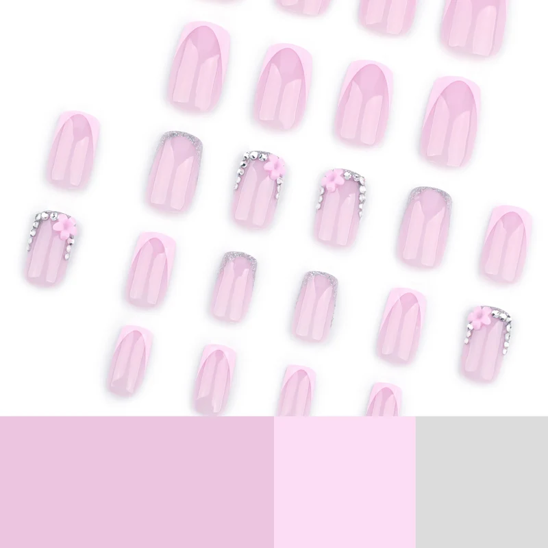 Kunstvolle Gel-Nägel mit eleganten floralem Design und Glitzerakzenten Karnz