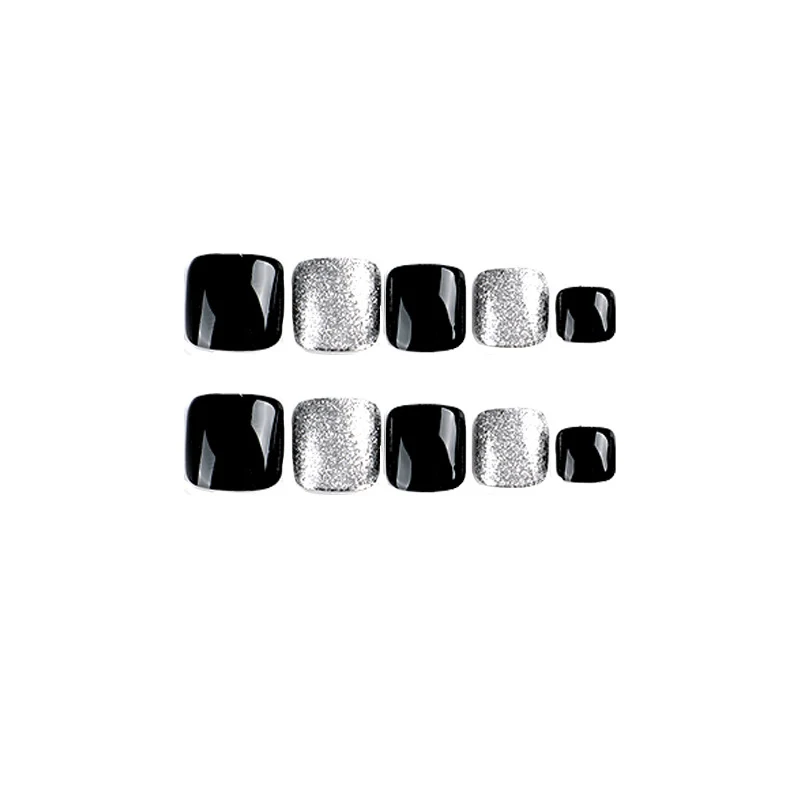 Kunstvolle Fußnagelkunst mit Glitzer- und Schwarzdesign Karnz