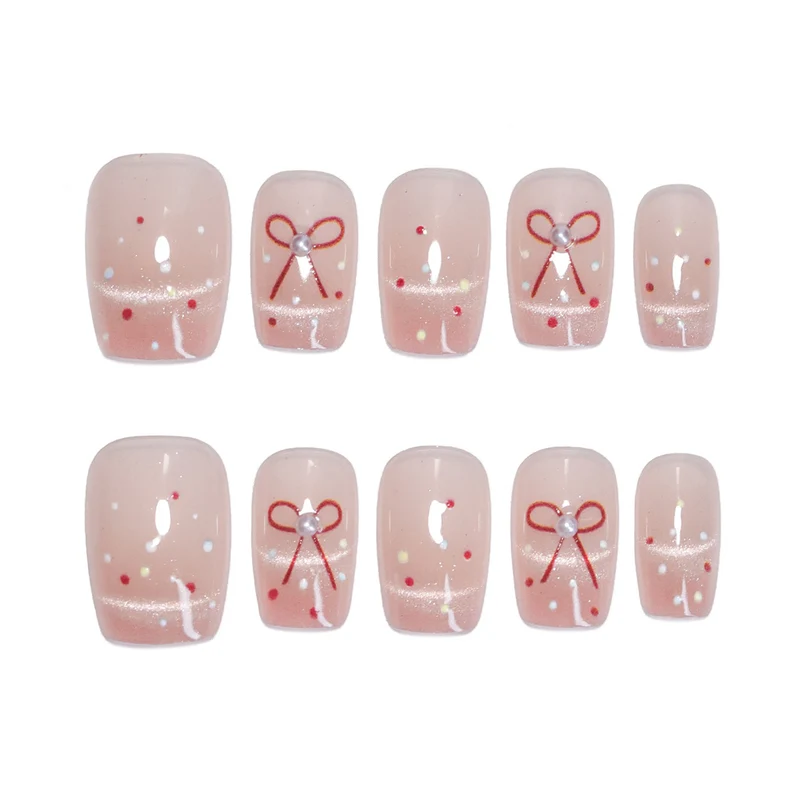 Künstliche Nagelkunst mit eleganten Schleifen und Glitzerakzenten Karnz