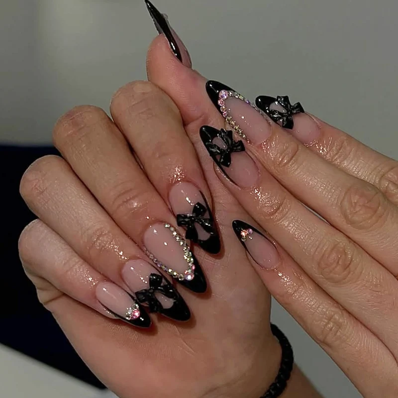 Elegant Stiletto Nail Design with Rhinestone Accents Stornfield