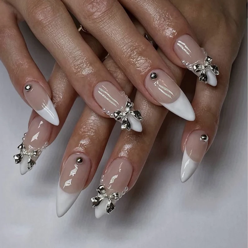 Elegant Stiletto Nail Art with Rhinestone Accents Stornfield
