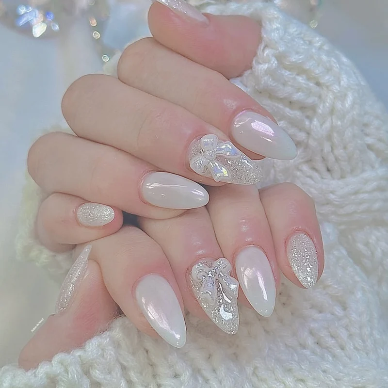 Elegant Stiletto Nail Art Extensions with 3D Bow Accents Stornfield