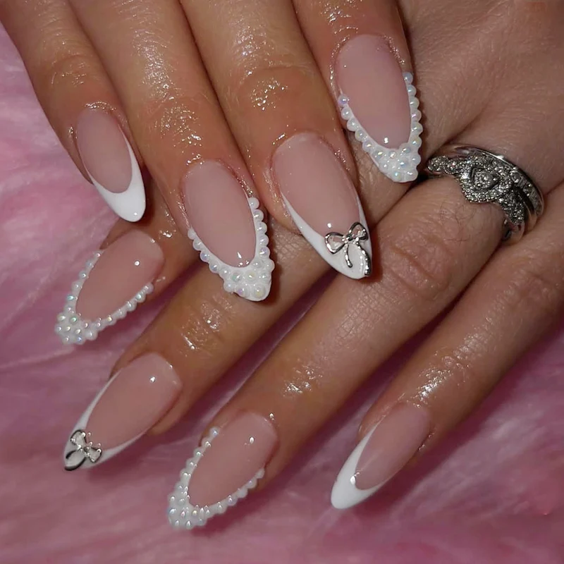 Elegant Pearl-Accentuated Stiletto Nail Art Stornfield