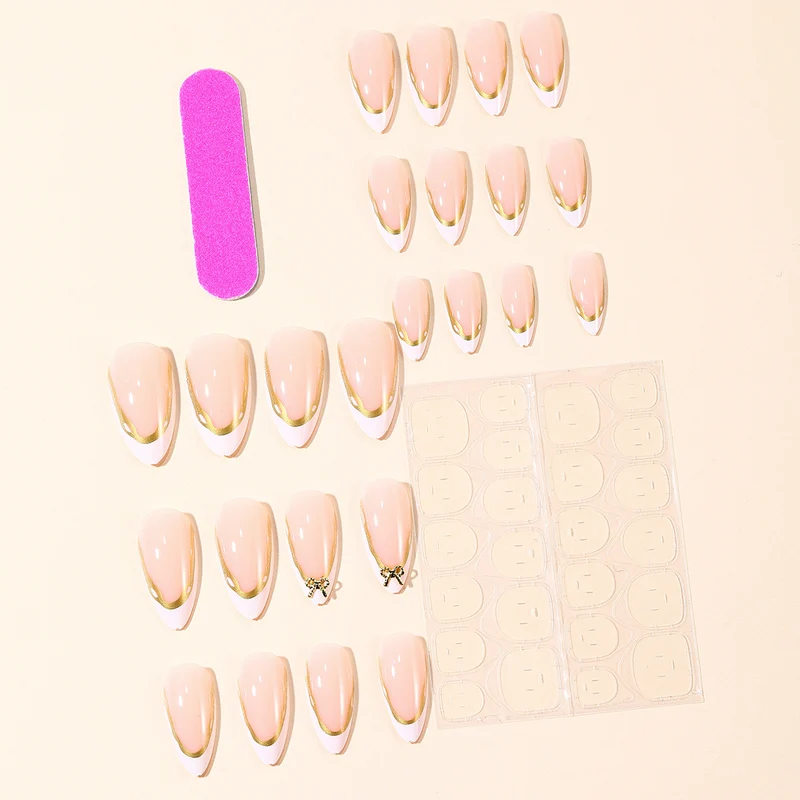 Elegant French Tip Nail Extensions with Gold Accents Stornfield