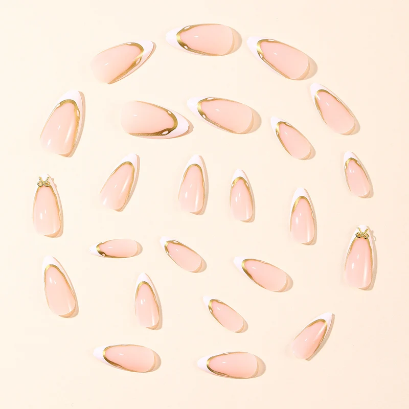 Elegant French Tip Nail Extensions with Gold Accents Stornfield
