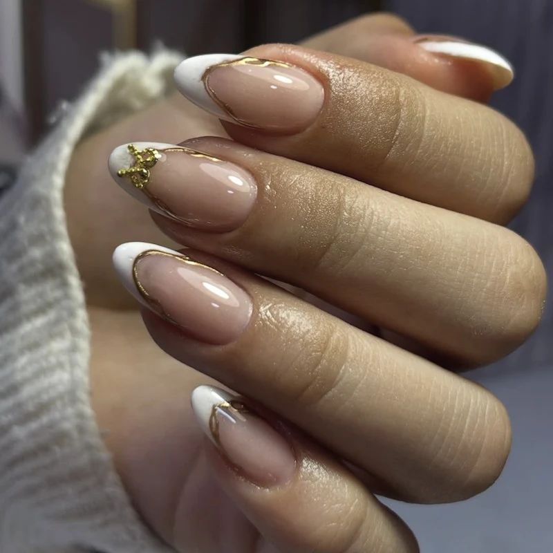 Elegant French Tip Nail Extensions with Gold Accents Stornfield