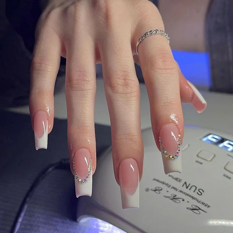 Elegant French Tip Acrylic Nail Extensions with Rhinestone Accents Stornfield