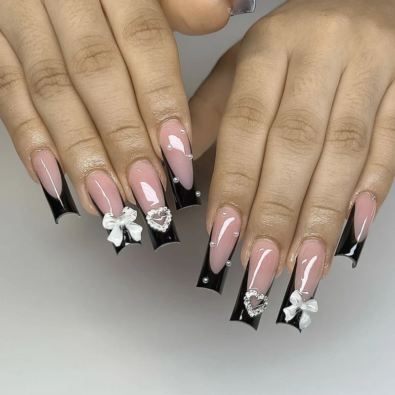 Elegant 3D Bow and Heart Nail Art Stornfield