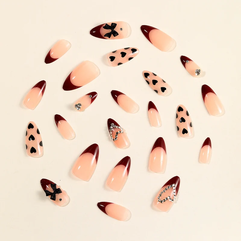 Artistic Stiletto Nail Art Extensions with Heart and Bow Accents Stornfield