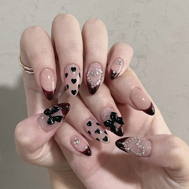 Artistic Stiletto Nail Art Extensions with Heart and Bow Accents Stornfield