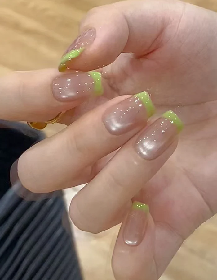 Glossy French Tip Press-On Nails Set with Vibrant Green Accents Stornfield