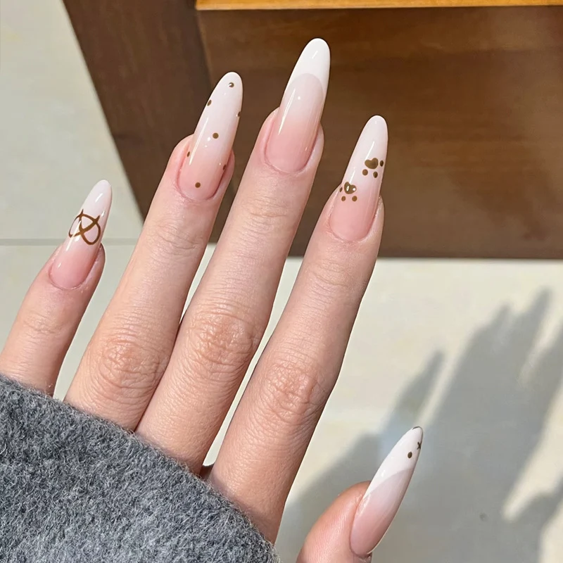 Glamorous Stiletto Press-On Nail Design with Elegant Gold Accents Stornfield