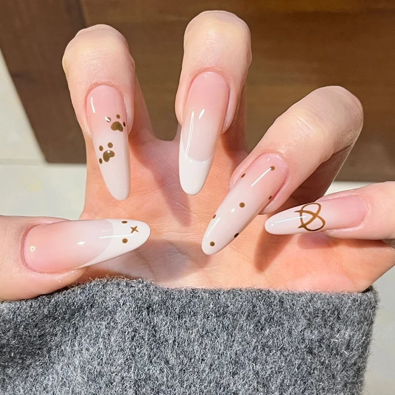 Glamorous Stiletto Press-On Nail Design with Elegant Gold Accents Stornfield