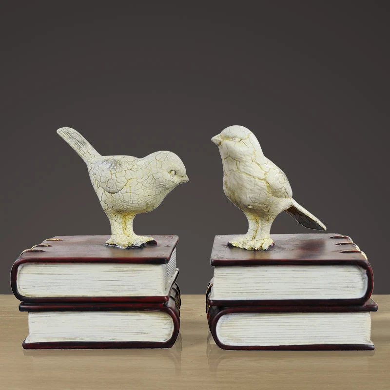 Dekorative Buchstützen mit Vogel-Figuren