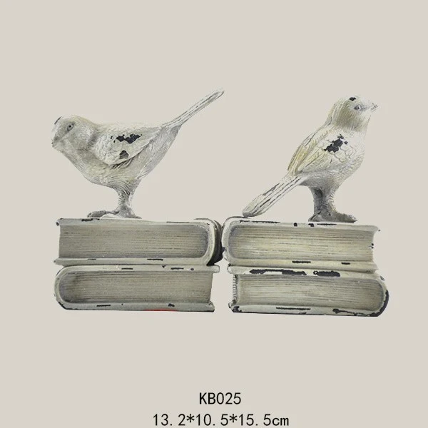 Dekorative Buchstützen mit Vogel-Figuren