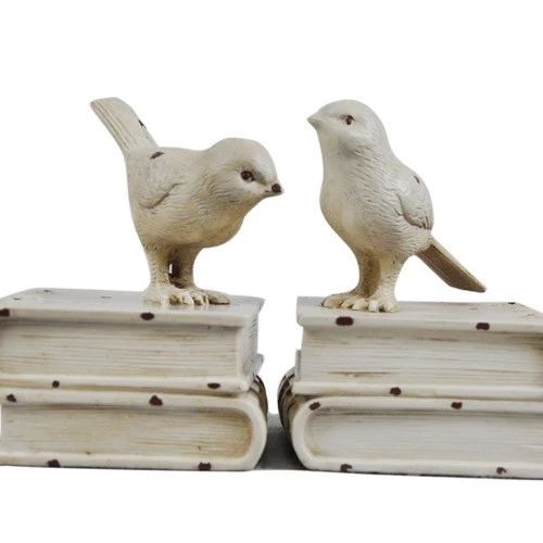 Dekorative Buchstützen mit Vogel-Figuren
