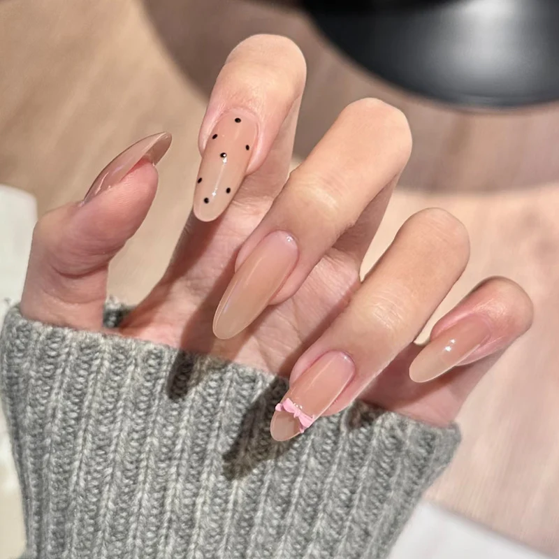 Elegant Press-On Nail Set with Chic Black Dots and Decorative Bow Stornfield