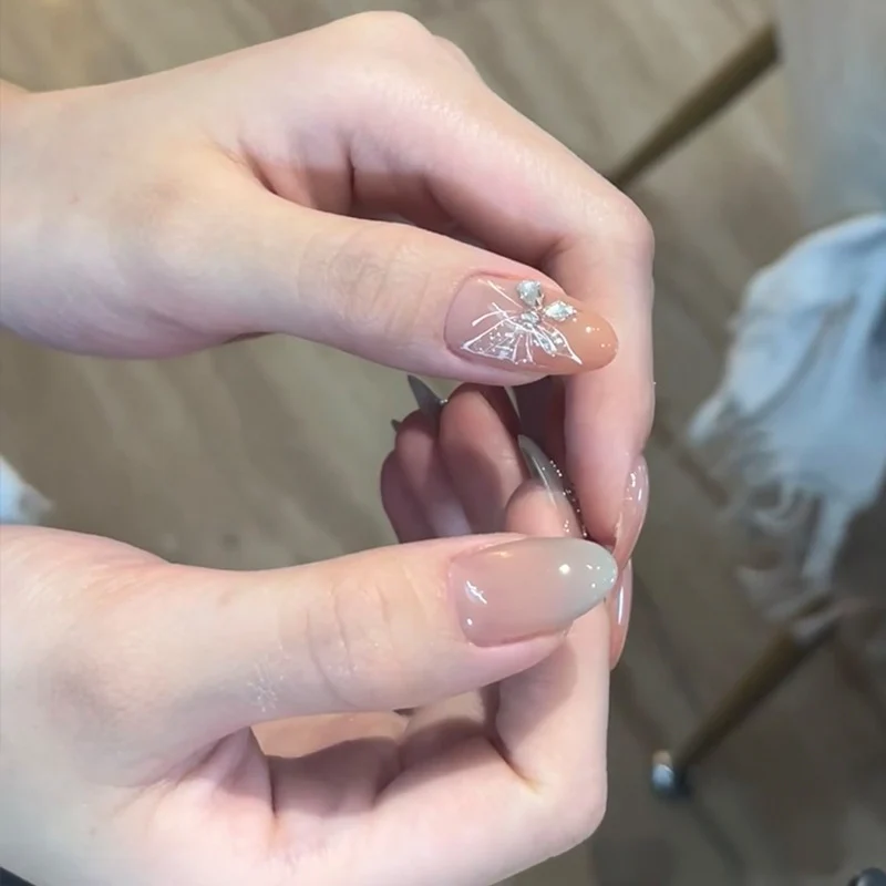 Elegant Press-On Nail Art Set with Floral and Gemstone Accents Stornfield