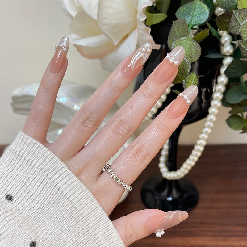Elegant Pearl-adorned Nail Art Stornfield
