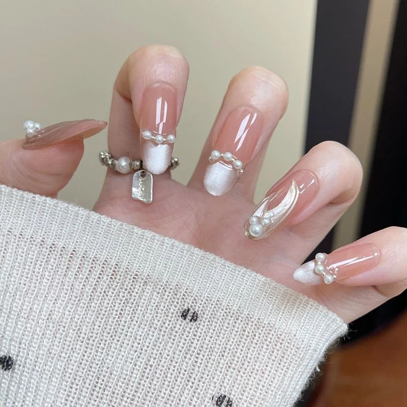 Elegant Pearl-adorned Nail Art Stornfield