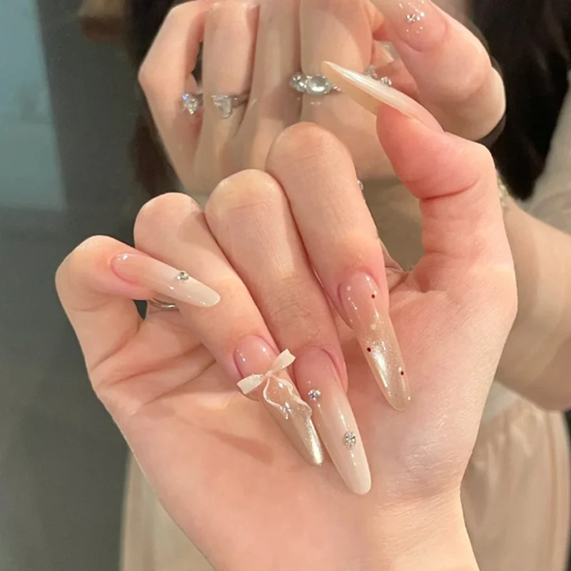 Elegant Stiletto Press-On Nails with Decorative Bow and Rhinestone Accents Stornfield