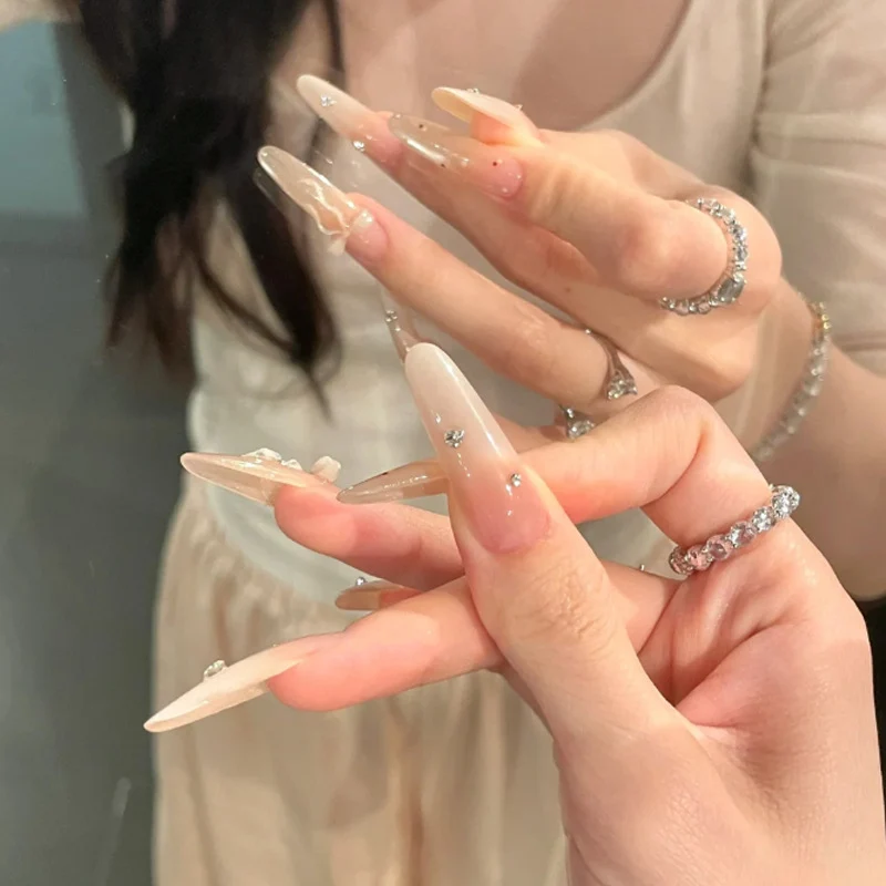 Elegant Stiletto Press-On Nails with Decorative Bow and Rhinestone Accents Stornfield