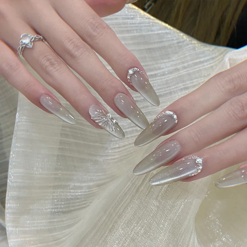 Elegant Stiletto Press-On Nail Extensions with Floral and Rhinestone Accents Stornfield