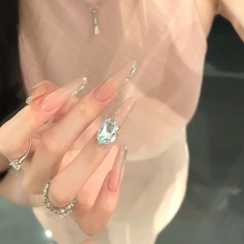 Elegant Stiletto Press-On Nail Design with Gemstone Accents Stornfield
