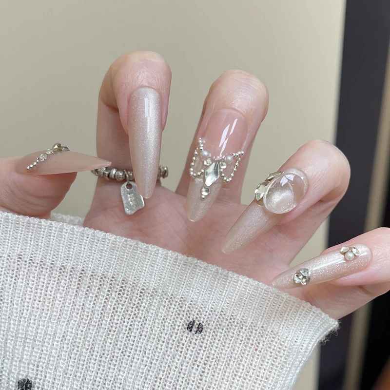 Elegant Stiletto Press-On Nail Art with Rhinestone and Pearl Accents Stornfield